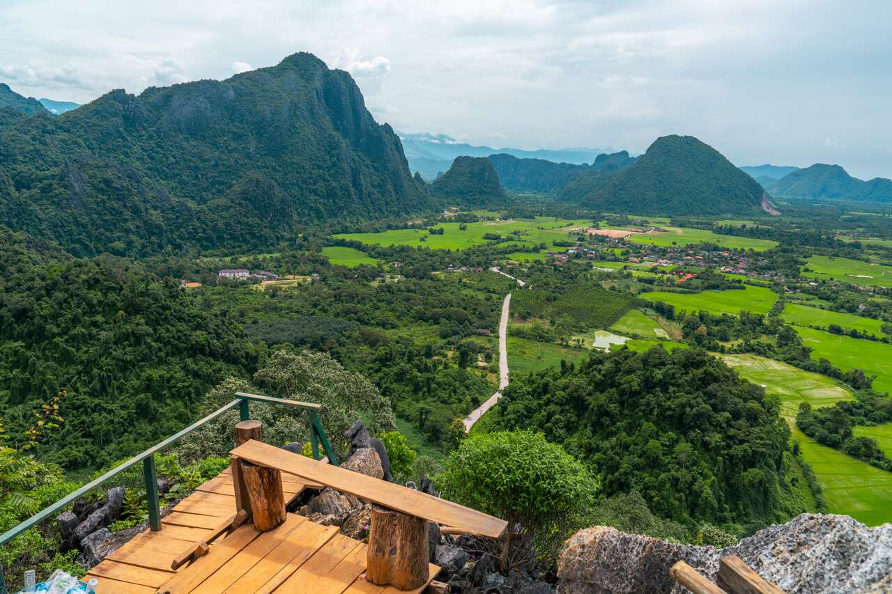 Begin your travel day with Vang Vieng’s serene ambiance